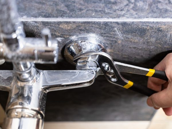 plumber-unscrews-nut-of-shower-faucet-close-up-2022-04-12-23-04-39-utc (1) (1)